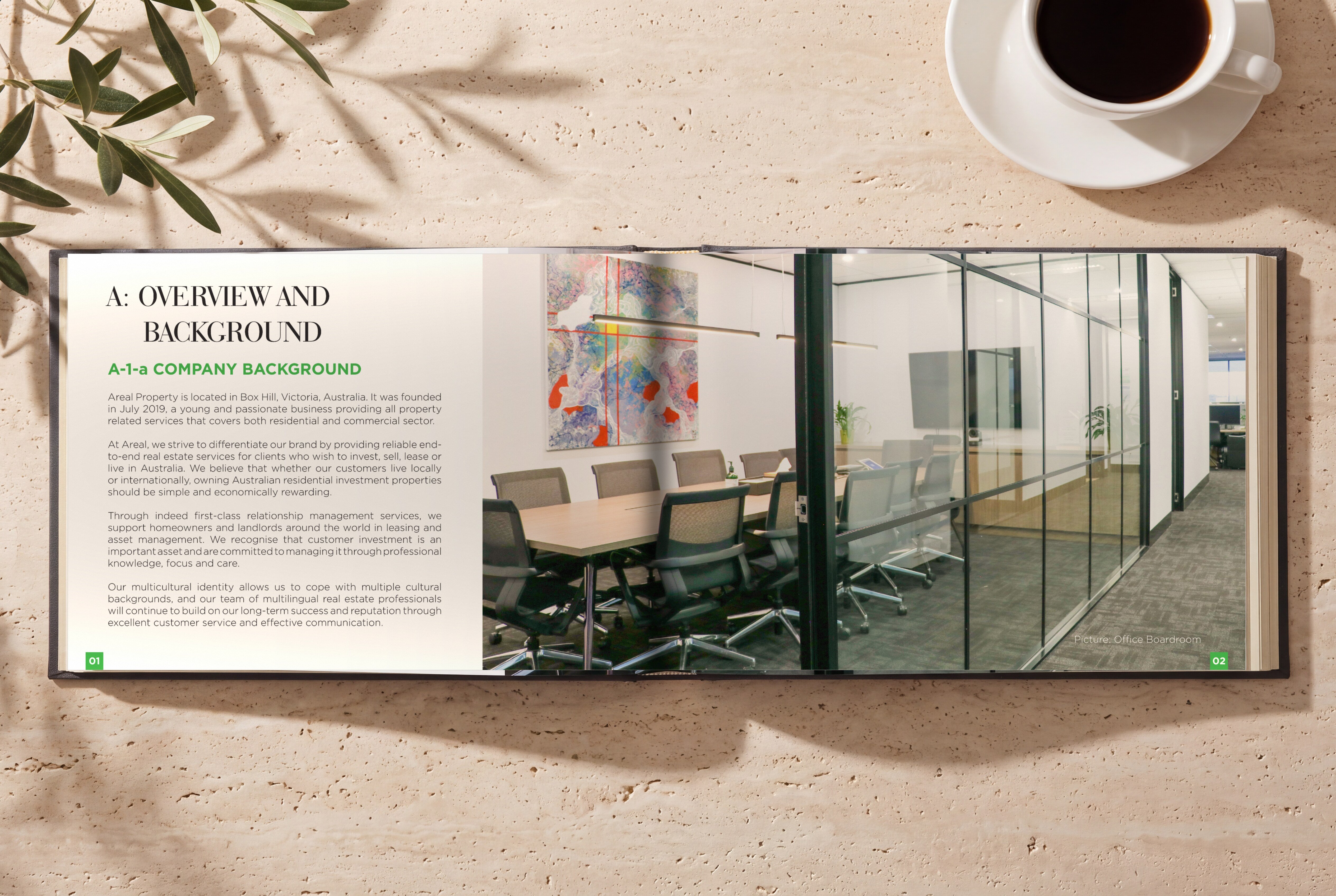 Brochure open at Overview and background on travertine, the company background page facing a photo of a glass-walled boardroom, beside a cup of coffee