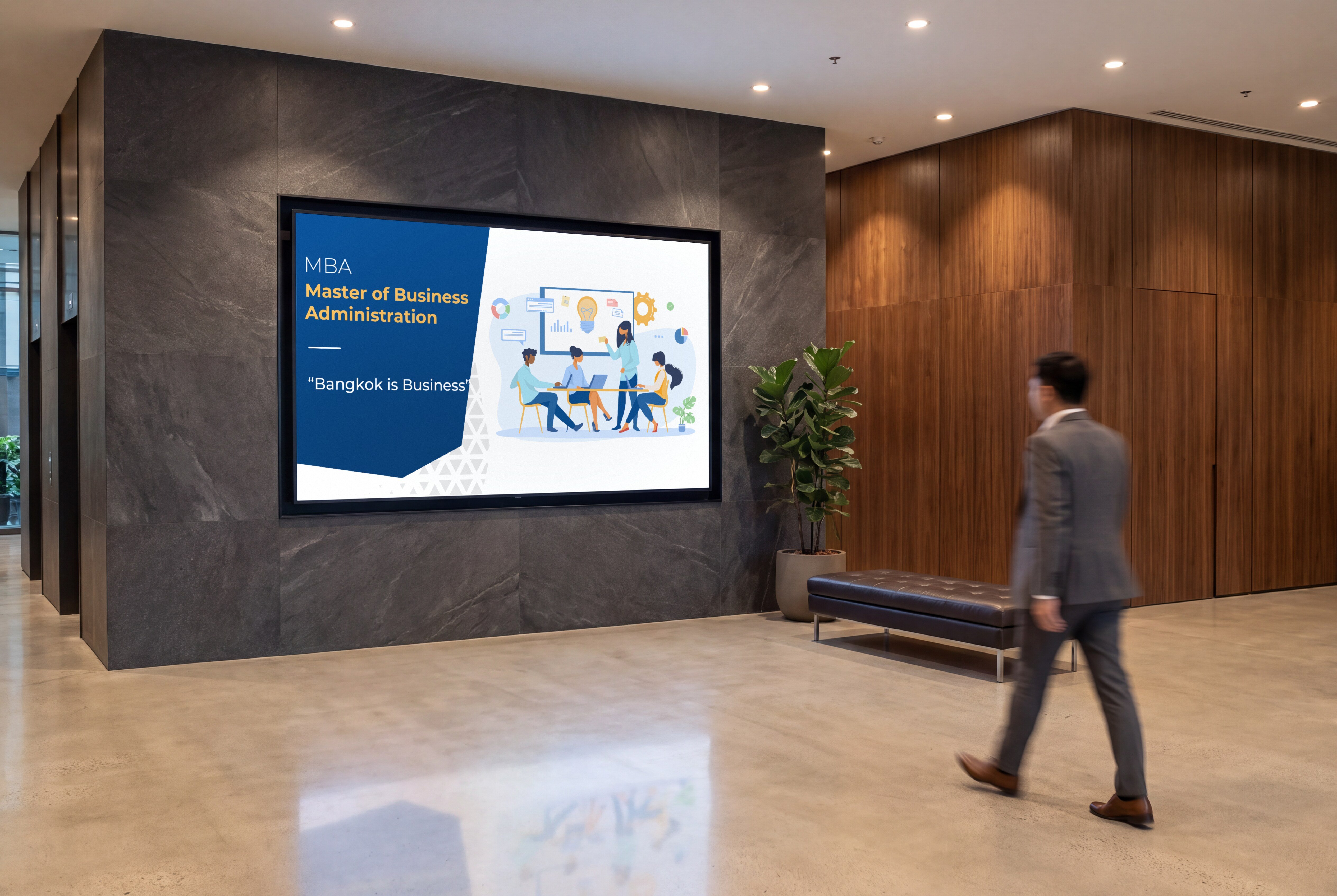 Webster's MBA ad, Bangkok is Business, on a large screen set into a dark stone wall in an office lobby, a man in a suit walking past